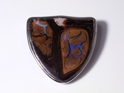 Handcrafted silver jewelry accentuating a unique boulder opal stone