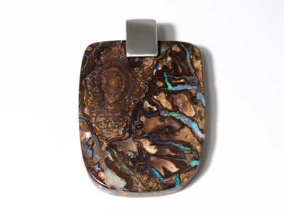 Uncut and raw Australian boulder opal specimen showing intense play-of-color
