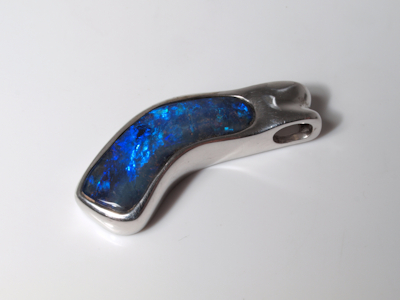 Handcrafted silver jewelry featuring a natural Australian boulder opal