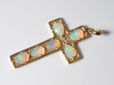 Exclusive gold jewelry piece featuring a vibrant crystal opal from Australia