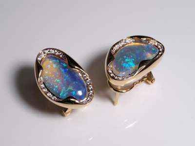 Stunning gold drop earrings set with iridescent Australian crystal opals