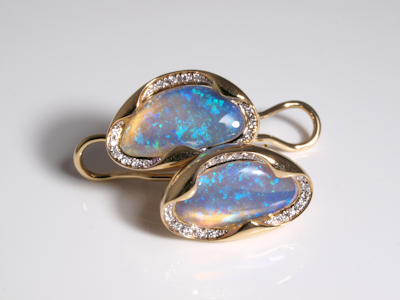 Delicate gold stud earrings featuring natural crystal opals
