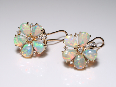 Premium gold jewelry handcrafted with a fiery crystal opal gemstone