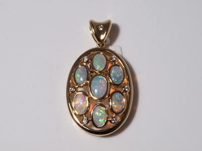 Luxurious gold jewelry ring set with a genuine Australian crystal opal